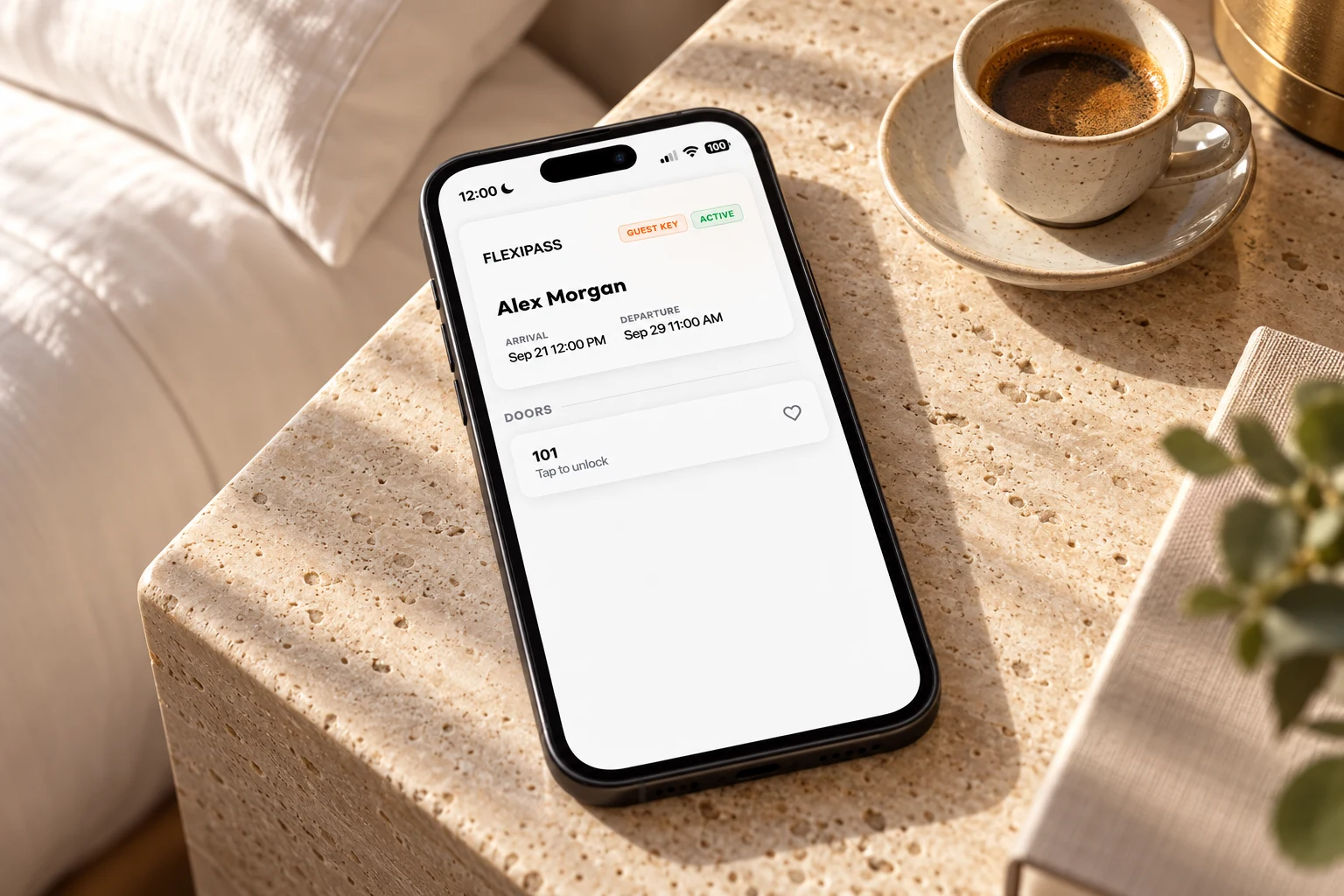 Illustrative FLEXIPASS Webkey on a phone beside a coffee